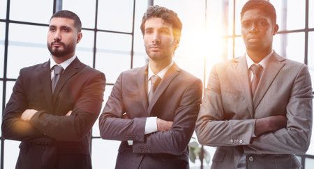 three businessmen crossing their arms looking at camera
