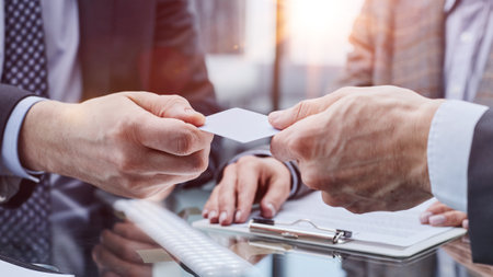businessman offer personal contact information to customer, acquaintance conceptの写真素材
