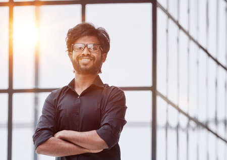 Successful young man crossed arms. Handsome businessman smart man in casual shirt.の写真素材