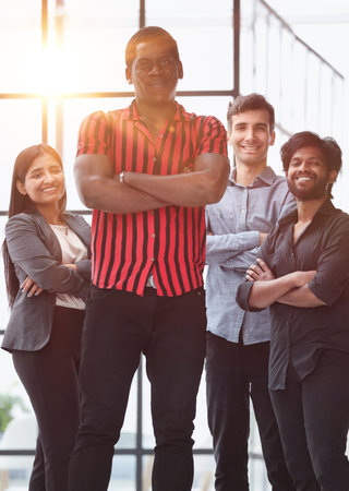 Group of business professionals in casual wear posing in a conference roomの写真素材