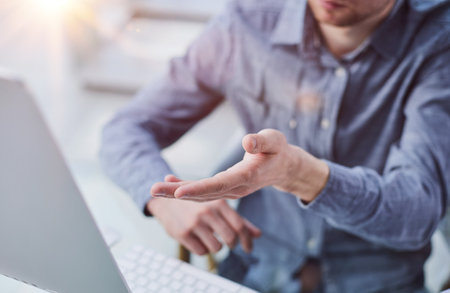 Man Looking At Pc Computer For Mock Up Template Sitting At Deskの写真素材