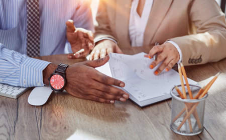 Financial advisor asking for womans signature for insurance, legal paperwork or claim documentの写真素材