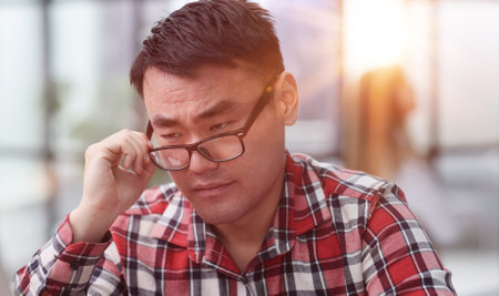 Modern office businessman in casual clothes working on a computer.の写真素材