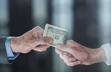 exchange of money cards between businessmen, close-upの写真素材