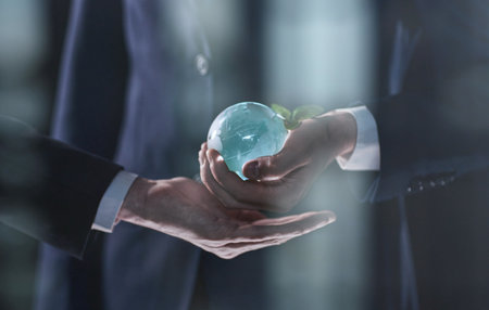 male hands holding a glass globe close-up
