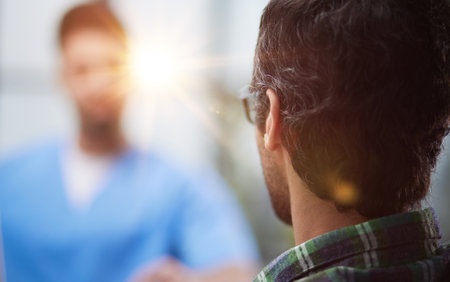 Doctor with patient in medical office at the receptionの写真素材