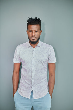 Studio shot of intelligent male manager indoor