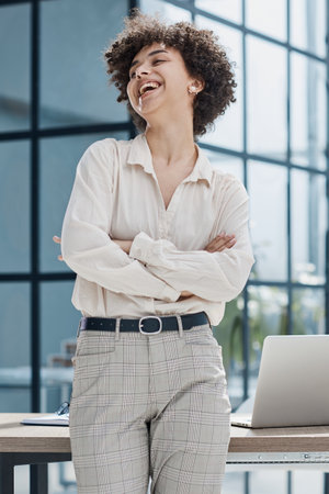 girl in the office smiles expresses success and leadershipの写真素材