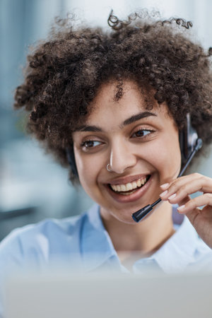 girl in a modern office working in a call center smiling