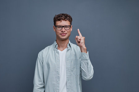portrait of a young man on a gray backgroundの写真素材