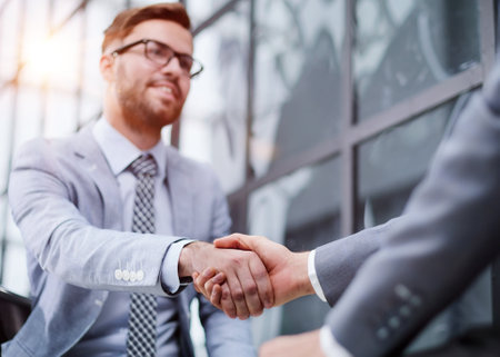 Business people shaking hands, finishing up meetingの写真素材