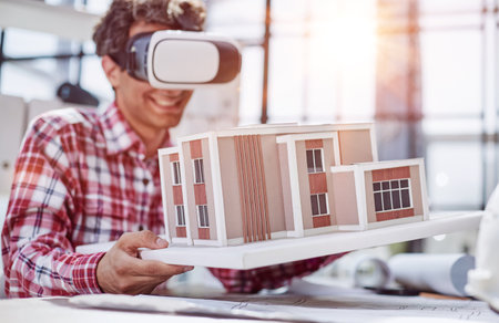 Virtual reality futuristic design technology. Architect or design engineer in VR headset for BIM technologyの写真素材