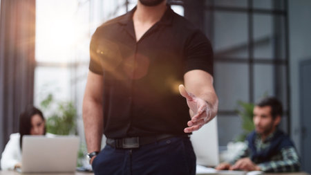 business man offering handshake in office acquisition concept.の写真素材
