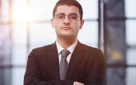Handsome business CEO executive business man with crossed armsの写真素材