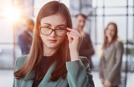 Portrait, Professional and confident millennial businesswoman or female executive manager in formal suit and eyeglassesの写真素材