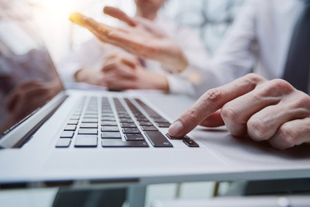 Male hands or men office worker typing on the keyboardの写真素材