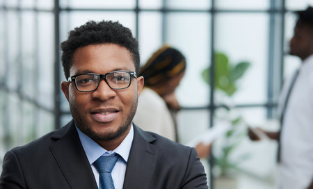 Head shot of confident young handsome black man looking at camera.の写真素材