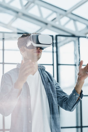 Businessman using vr glasses to view educational material and financial documents