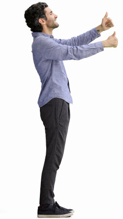 full-length portrait of a young man. standing isolated on white backgroundの写真素材