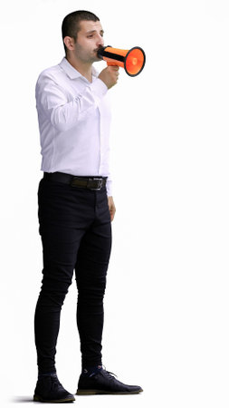 man isolated on a white background in business clothes with a loudspeaker in his handの写真素材