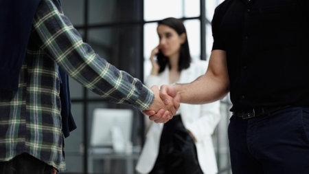 Close-up of two business people shaking hands