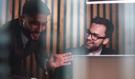Young business male meeting with a colleague in office at work