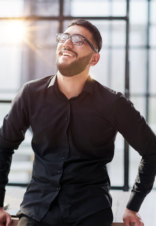portrait of a young businessman who is smiling