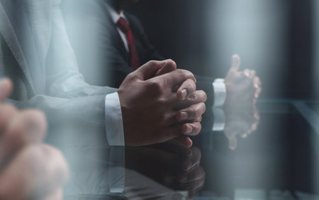 Close up of male hands holding a pair of glassesの写真素材