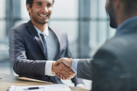 Businessman handshake for teamwork of business merger and acquisitionの写真素材