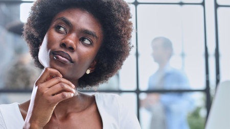 business woman with her staff in background at officeの写真素材