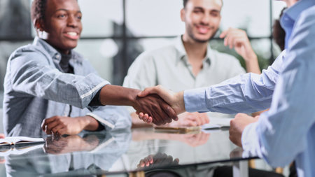 Congratulating the new partners in modern officeの写真素材