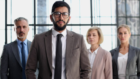 Business team and a leader, business man with his colleaguesの写真素材