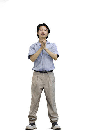 A guy in a blue shirt, on a white background, in full height, folded his armsの写真素材