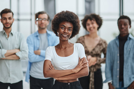 business woman with her staff in background at office