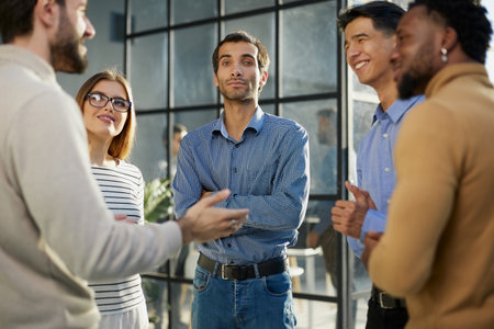Business conversations of different people during an office walkの写真素材