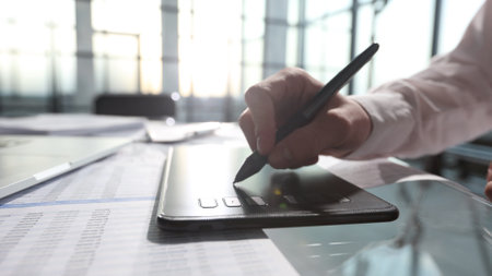 The artist uses a graphic tablet