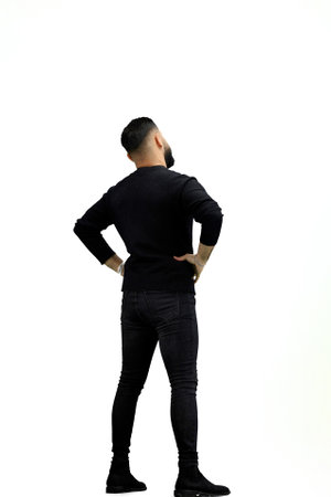Man, full-length, on a white background, hands on hipsの写真素材