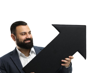 A man, close-up, on a white background, shows an arrow to the sideの写真素材