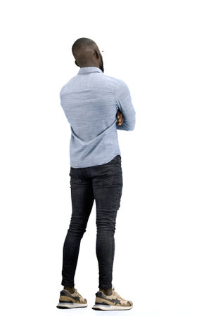 A man, full-length, on a white background, spreads his armsの写真素材