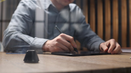 The artist uses a graphic tablet for an art concept