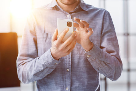 close up.a businessman uses a smartphone. people and technology