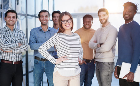 Business people in elegant casual clothes are standing in the officeの写真素材