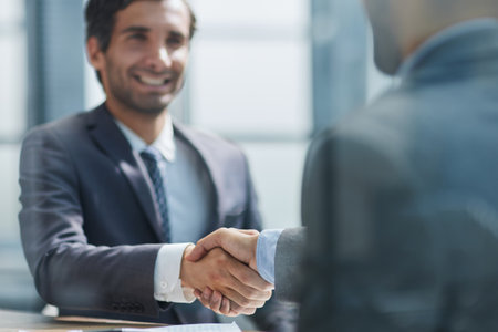Businessman handshake for teamwork of business merger and acquisitionの写真素材