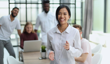 young successful businesswoman in white shirt smilingの写真素材