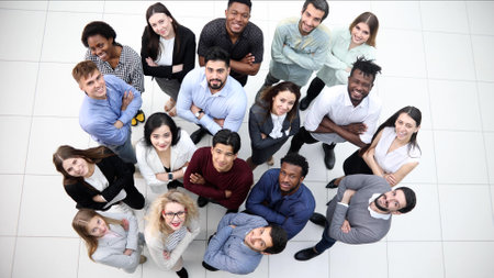 large group of diverse young people looking up hopefullyの写真素材