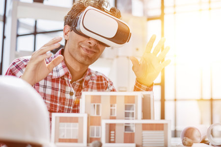 Virtual reality futuristic design technology. Architect or design engineer in VR headset for BIM...