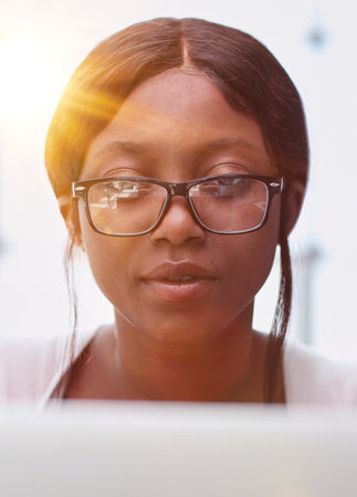 female employee or a businesswoman using a laptop in a modern office