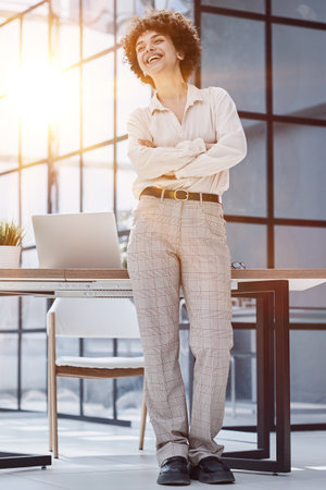 girl in the office smiles expresses success and leadership is thinking about successの写真素材