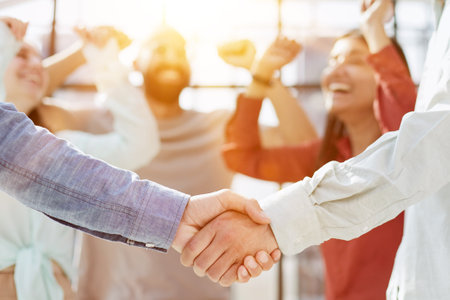 Corporate team, manager shaking hands in office for commitment, onboarding or client negotiationの写真素材