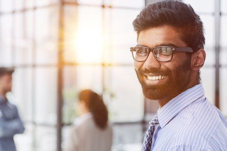 Close-up photo portrait of successful and happy businessman looking at cameraの写真素材